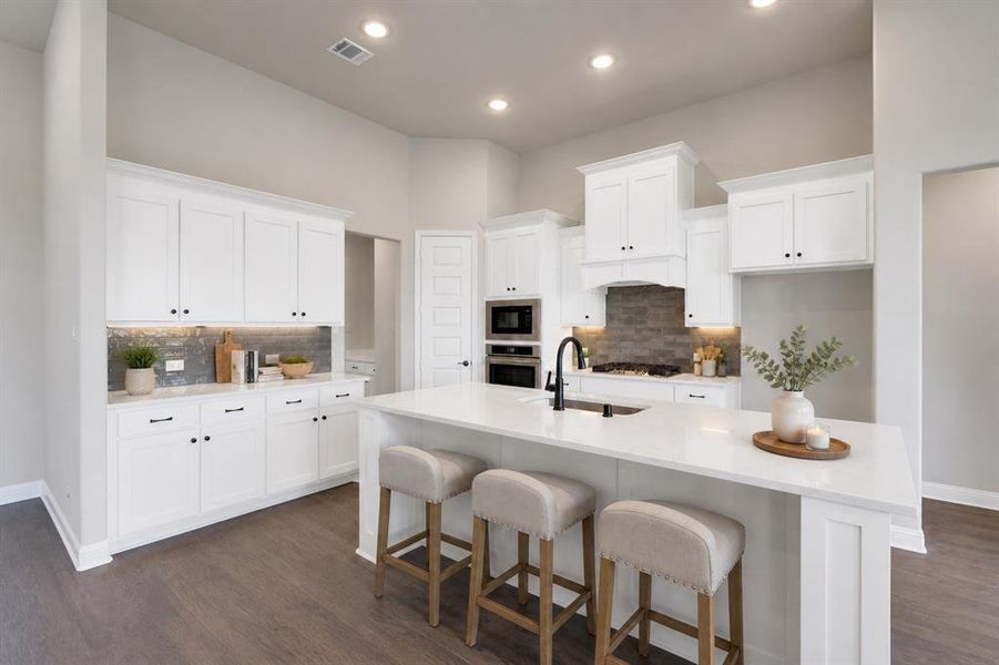 Designer kitchen with oversized island and gas cooking. Virtually staged for visual