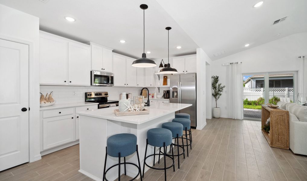 Kitchen adjacent to great room