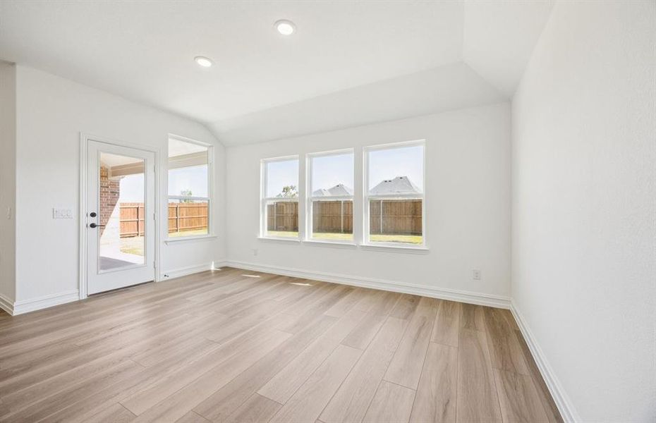 Dining nook off kitchen with large windows Dining nook off kitchen with large windows