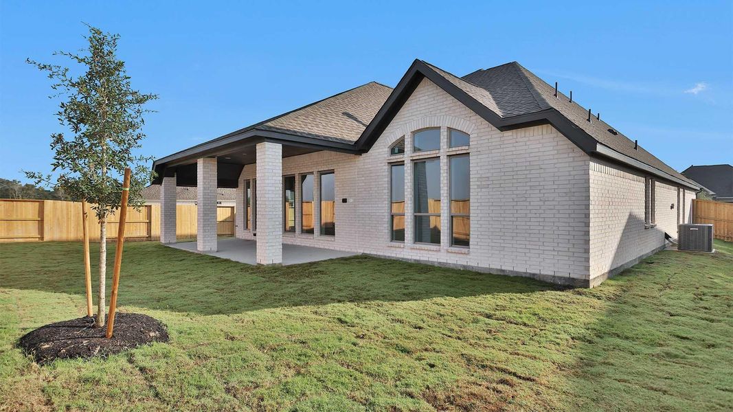 Exterior details and patio area of a home in Serenity 55+ Active Adult, Arcola (Image 4).