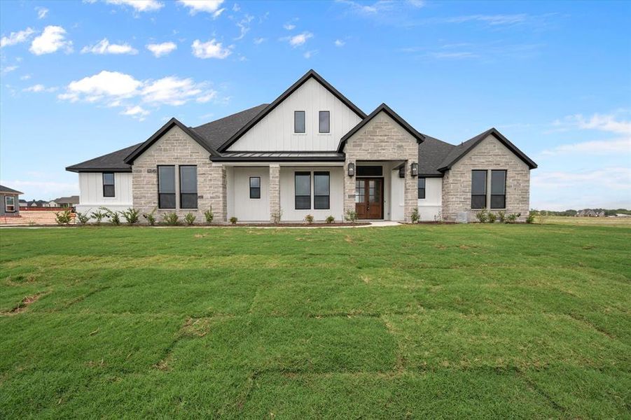 Front exterior of a new home in , Waxahachie, TX, highlighting curb appeal (Image 2). Front exterior of a new home in , Waxahachie, TX, highlighting curb appeal (Image 2).