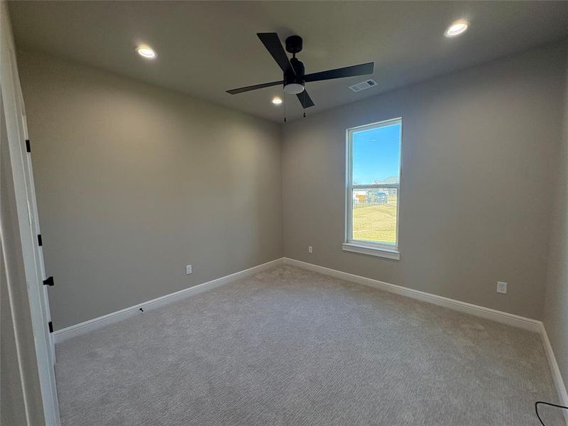 Empty room featuring carpet flooring, recessed lighting, and ceiling fan