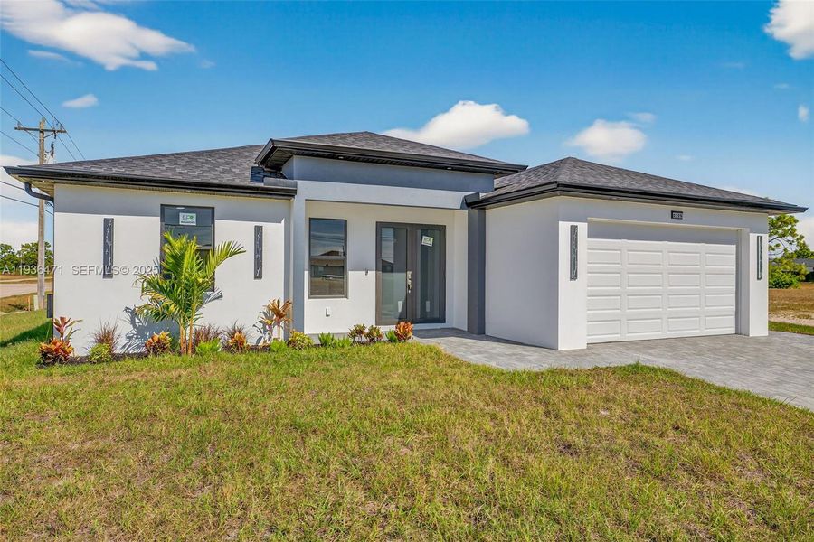 Front exterior of a new home in , Cape Coral, FL, highlighting curb appeal (Image 17).