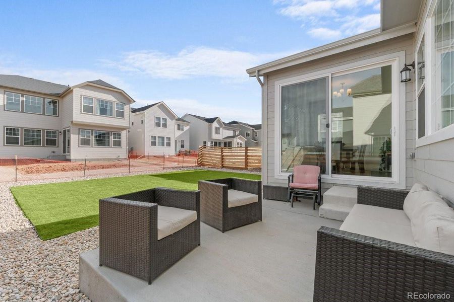 Exterior details and patio area of a home in The Aurora Highlands Town Collection, Aurora (Image 3). Exterior details and patio area of a home in The Aurora Highlands Town Collection, Aurora (Image 3).