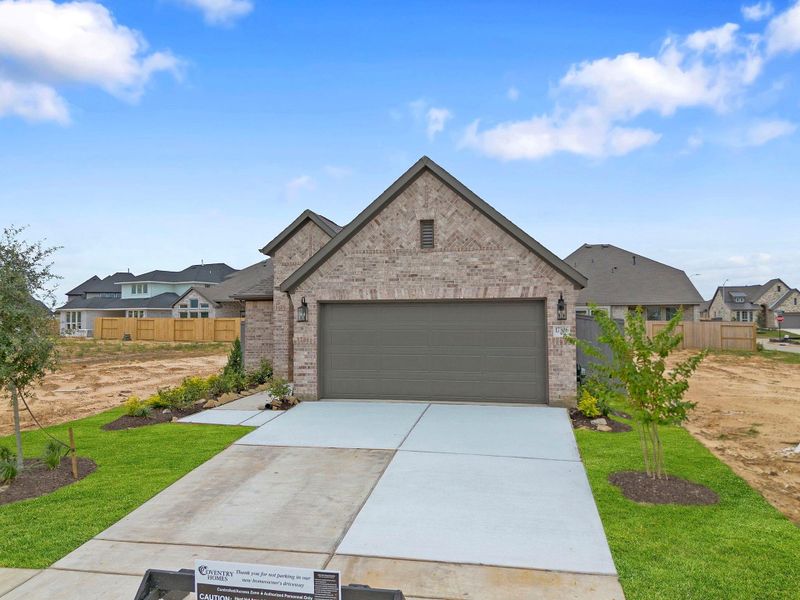 Front exterior of a new home in Jubilee 40', Hockley, TX, highlighting curb appeal (Image 2). Front exterior of a new home in Jubilee 40', Hockley, TX, highlighting curb appeal (Image 2).