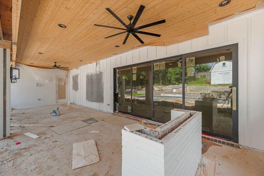 Huge back patio with outdoor kitchen and screens to enclose it Huge back patio with outdoor kitchen and screens to enclose it