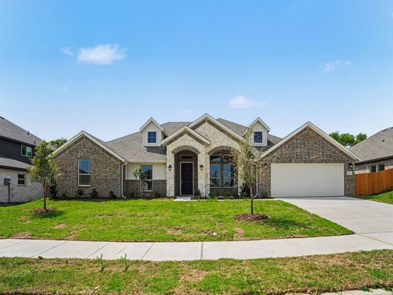 Front exterior of a new home in Cole Crossing Estates, DeSoto, TX, highlighting curb appeal (Image 19).