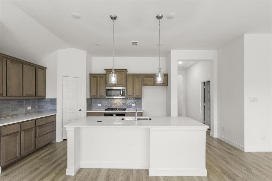 Unfurnished room featuring ceiling fan and light hardwood / wood-style floors