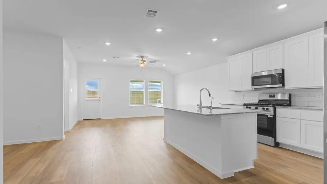 Furnished interior view inside a new home in Caldwell Crossing, Iowa Colony (Image 4).