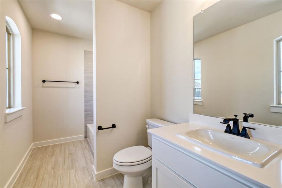 Full bath featuring vanity, recessed lighting, and bathtub / shower combination Full bath featuring vanity, recessed lighting, and bathtub / shower combination