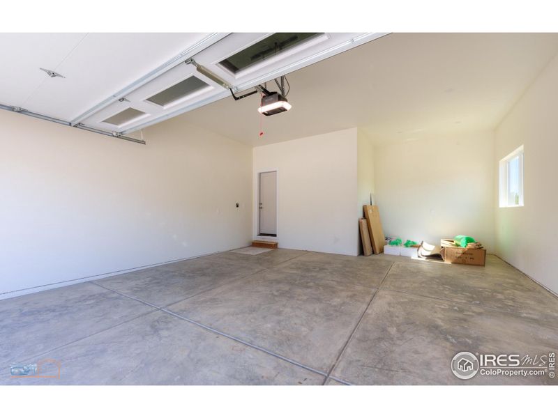 2.5 Car Garage With Extra Storage Area And 18'x8' Steel Garage Door.