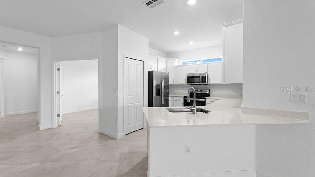 Furnished interior view inside a new home in Palm Lake at Coco Bay, Englewood (Image 6).