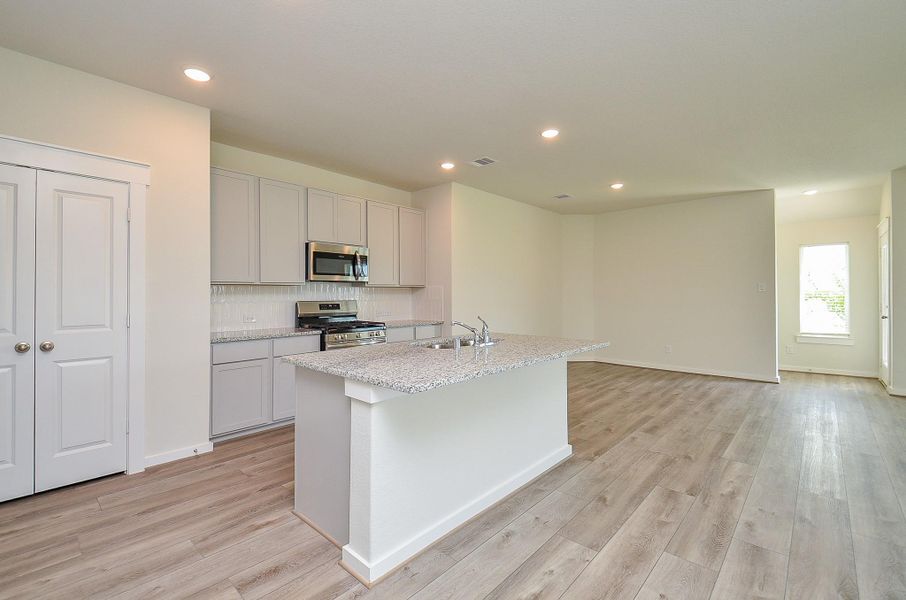 Furnished interior view inside a new home in Sunterra, Katy (Image 5).