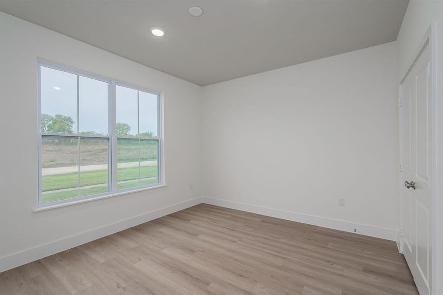 Spare room with light hardwood / wood-style floors