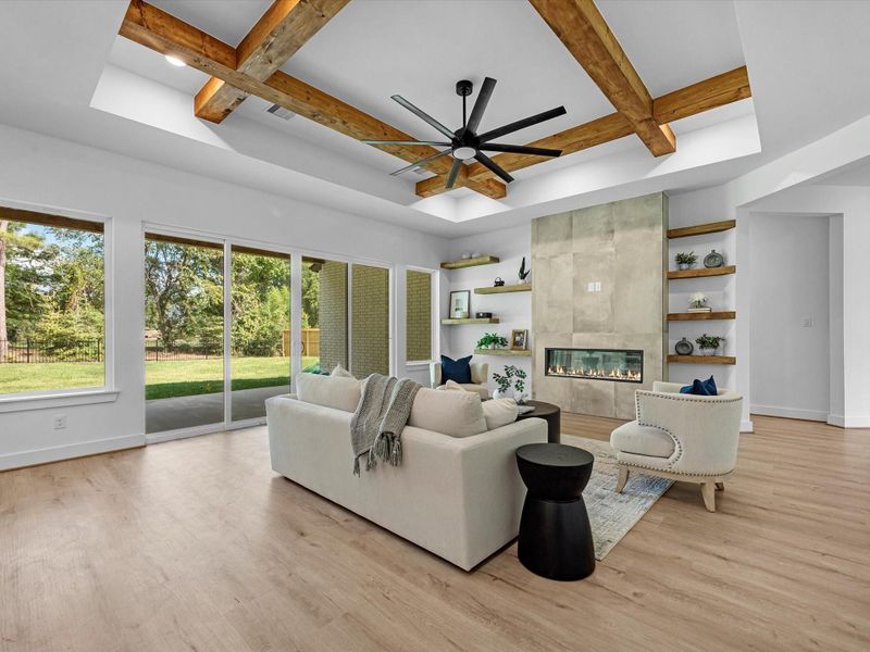 A very comfortable yet large great room, anchored by a distressed concrete tile fireplace