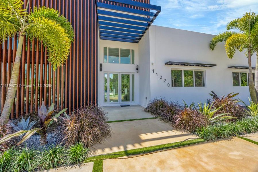 Front exterior of a new home in , Miami, FL, highlighting curb appeal (Image 32).