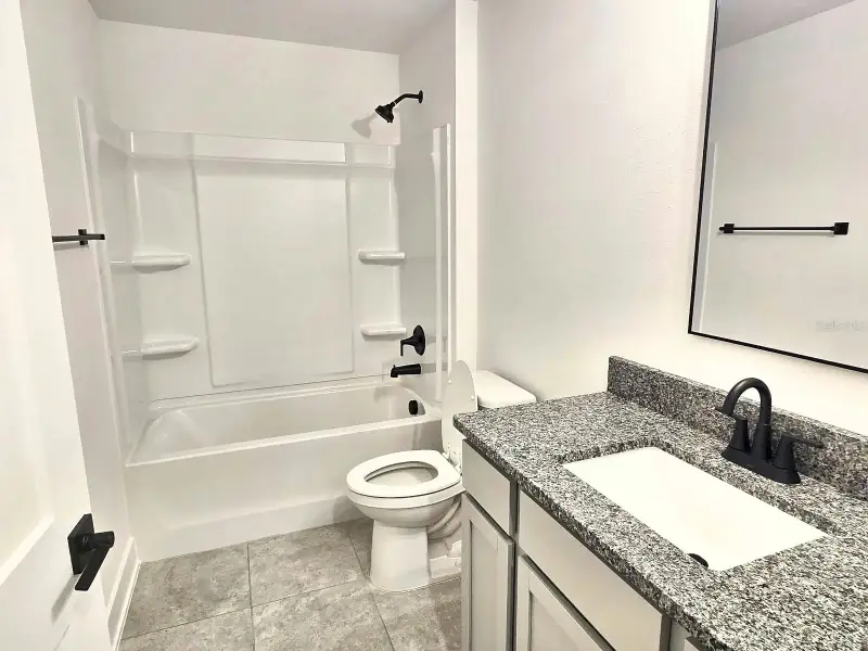 Furnished interior view inside a new home in Harmony Central, Harmony (Image 7).