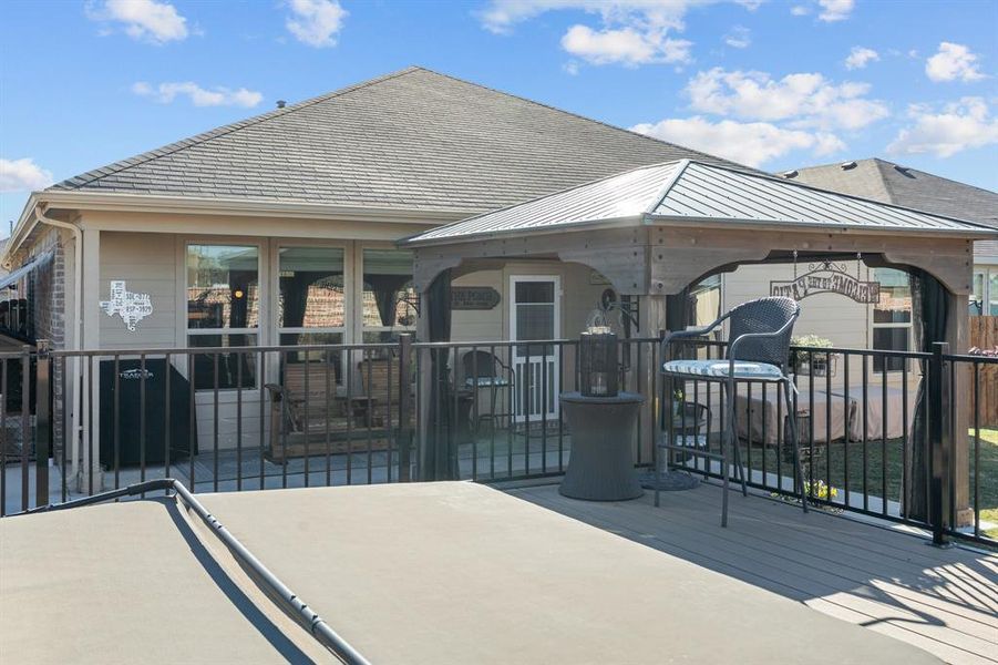 Rear view of property with a gazebo