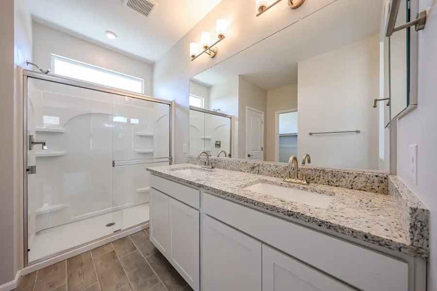 A bathroom with a glass shower.