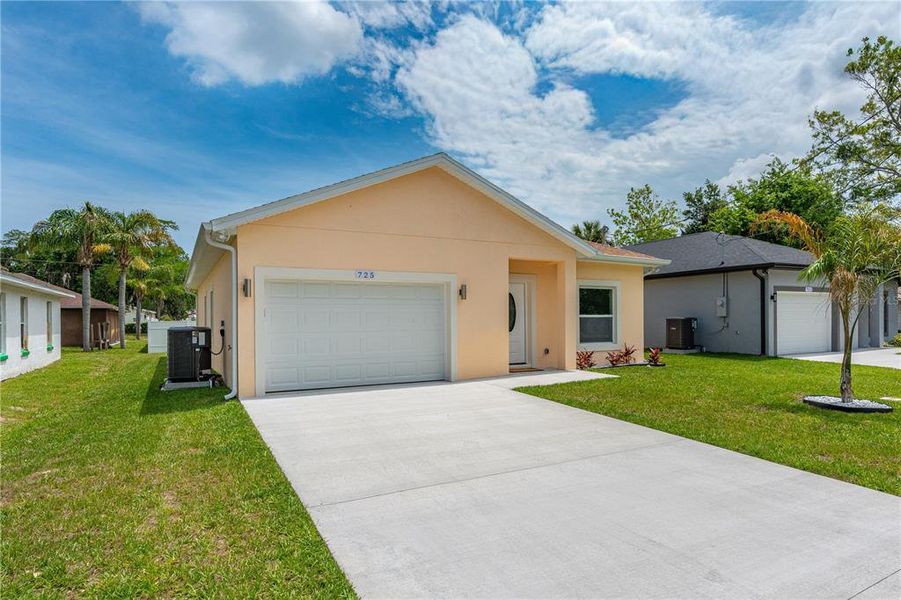 Front exterior of a new home in , Daytona Beach, FL, highlighting curb appeal (Image 23).