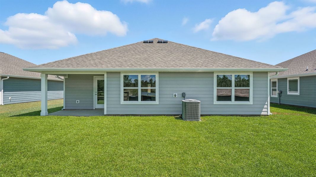 Front exterior of a new home in Palmetto Bluff, Port Saint Joe, FL, highlighting curb appeal (Image 19).