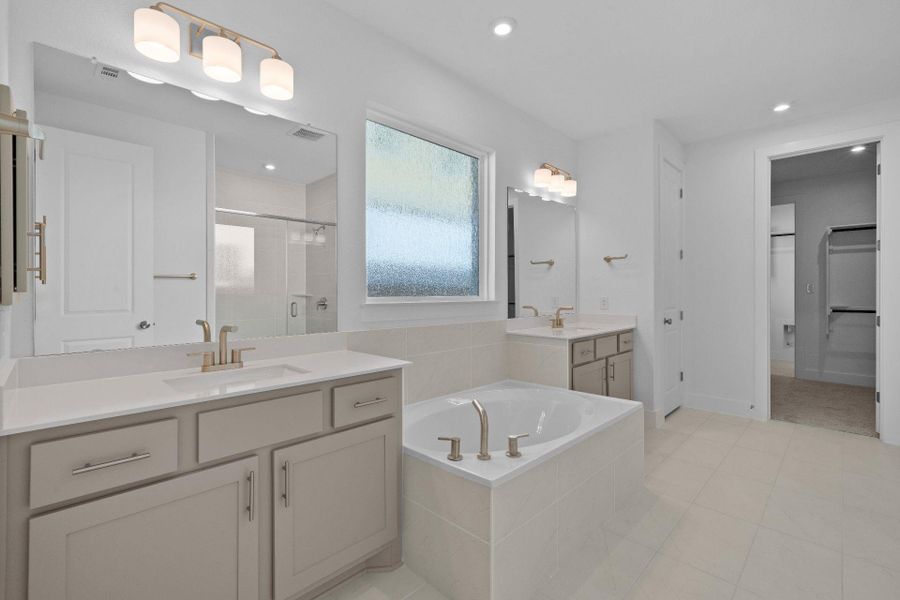 Primary Bath retreat with dual vanities & garden tub