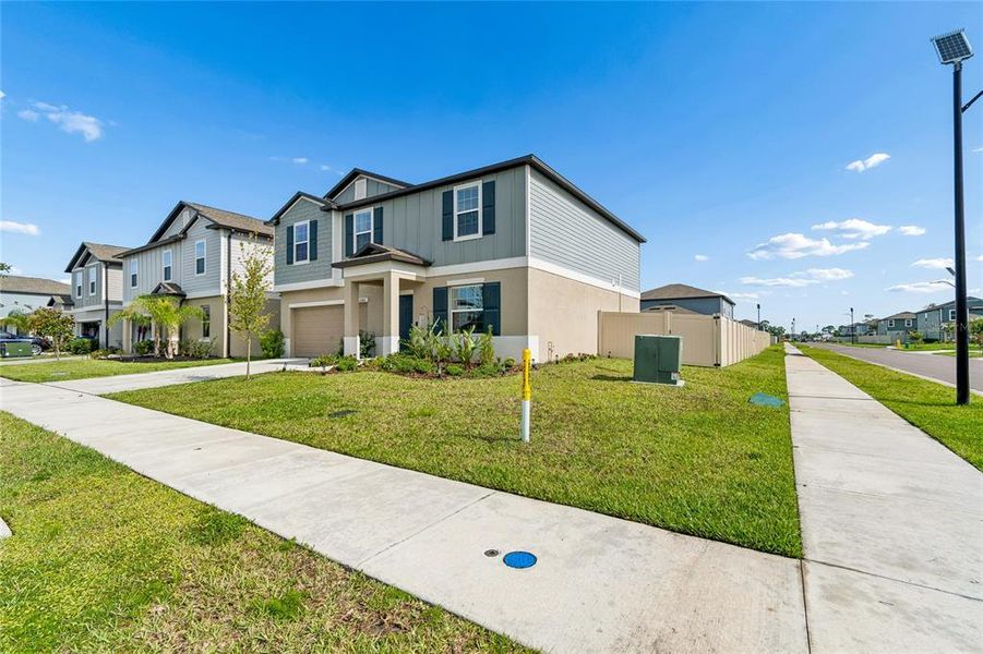 Front exterior of a new home in , Land O' Lakes, FL, highlighting curb appeal (Image 26).