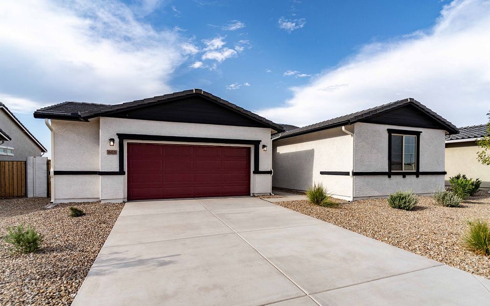 Front exterior of a new home in Rancho Mirage, Maricopa, AZ, highlighting curb appeal (Image 2).
