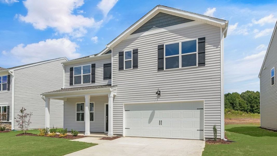 Front exterior of a new home in Tyler - Home on the Lake, New Bern, NC, highlighting curb appeal (Image 16). Front exterior of a new home in Tyler - Home on the Lake, New Bern, NC, highlighting curb appeal (Image 16).