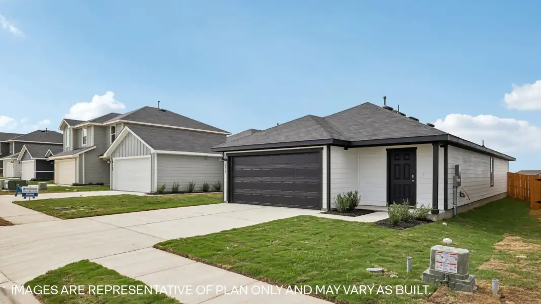 Front exterior of a new home in Marigold, Kyle, TX, highlighting curb appeal (Image 17).