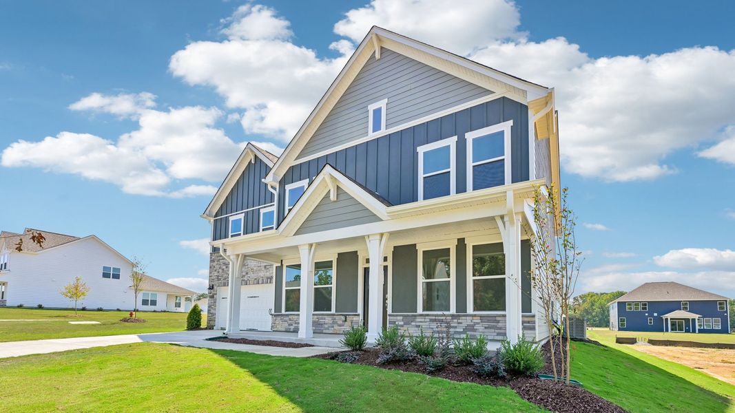 Front exterior of a new home in Eagle Creek, Fuquay Varina, NC, highlighting curb appeal (Image 18).