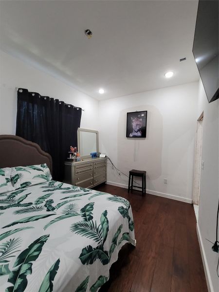 A dedicated laundry space boasts stacked appliances and bright tile flooring for effortless utility. A dedicated laundry space boasts stacked appliances and bright tile flooring for effortless utility.