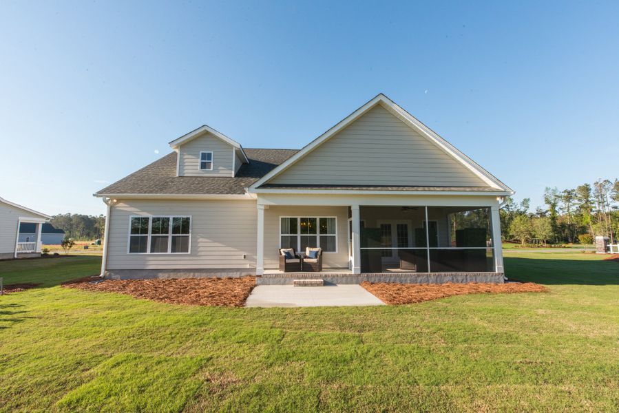 Representative exterior photo of a completed home built from the Helmsley by Bill Clark Homes in The Sanctuary at Sunset Beach, Sunset Beach, NC (Image 25). Representative exterior photo of a completed home built from the Helmsley by Bill Clark Homes in The Sanctuary at Sunset Beach, Sunset Beach, NC (Image 25).