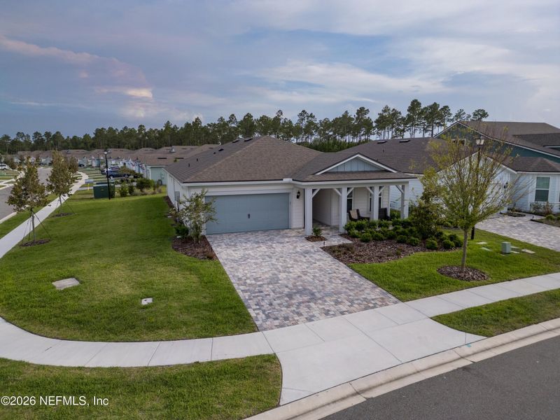 Front exterior of a new home in Del Webb Nocatee, Ponte Vedra, FL, highlighting curb appeal (Image 22).