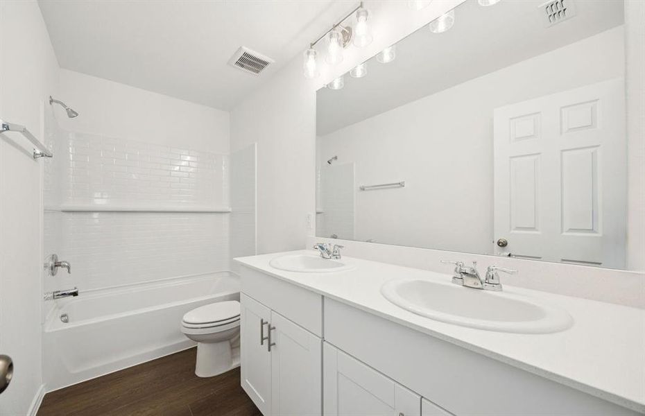 Secondary bathroom with double sinks Secondary bathroom with double sinks