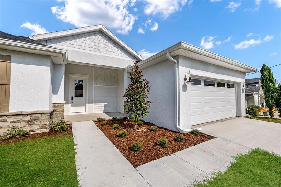 Front exterior of a new home in , Palm Coast, FL, highlighting curb appeal (Image 2). Front exterior of a new home in , Palm Coast, FL, highlighting curb appeal (Image 2).