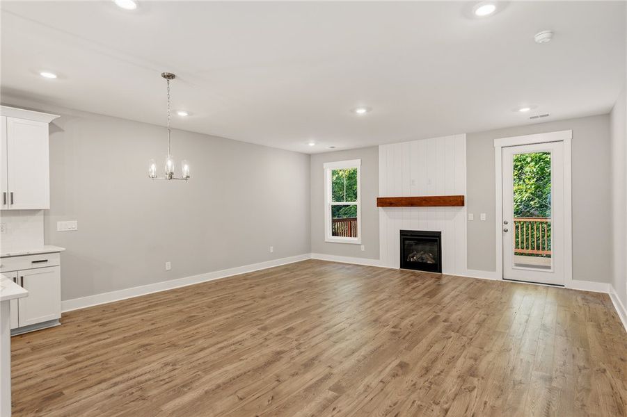 A well-lit gathering space with warm wood flooring