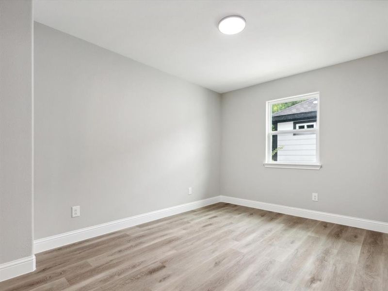 Empty room with wood-type flooring