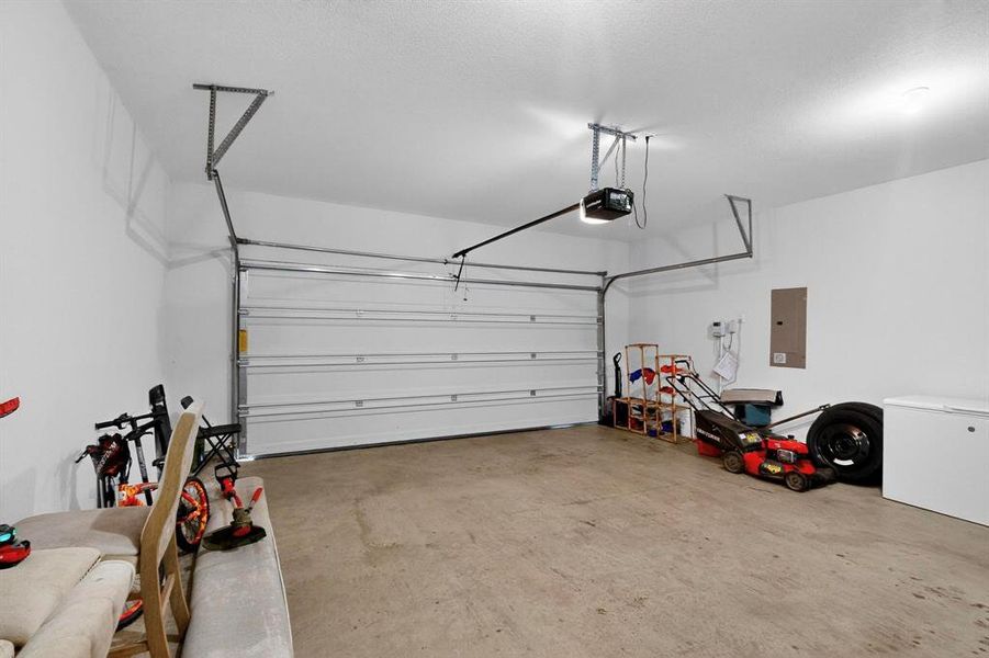 Garage with electric panel and a garage door opener Garage with electric panel and a garage door opener