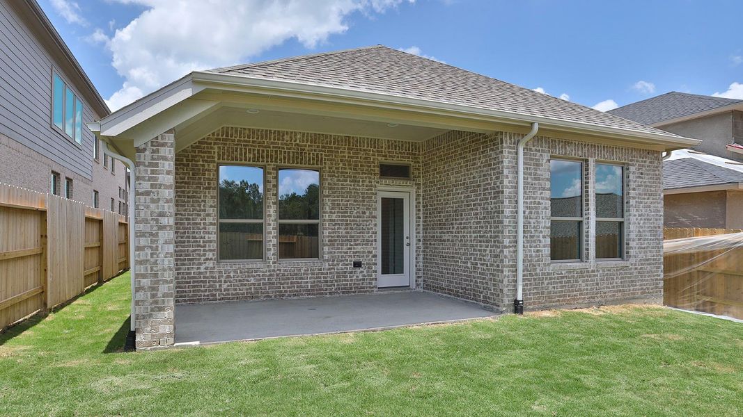 Exterior details and patio area of a home in Wildtree, Magnolia (Image 2). Exterior details and patio area of a home in Wildtree, Magnolia (Image 2).