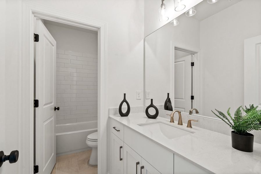 Representative furnished interior of a home built from the The Kenton by The Providence Group in Waterhaven, Cumming (Image 37).