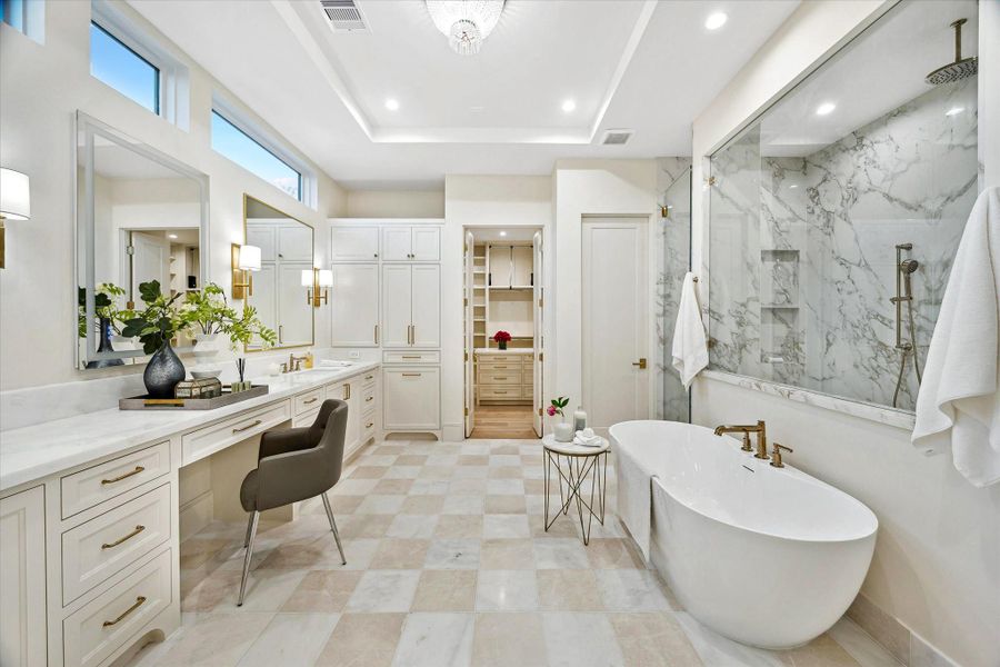 [Primary Bath] Rivals the most luxurious spas, featuring non-crystalized white marble floors, marble countertops, soaking tub, champagne brass hardware for an elevated daily indulgence.