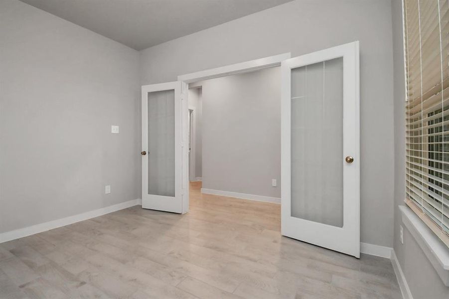 Home Office at the forefront of the home. Equipped with French doors.