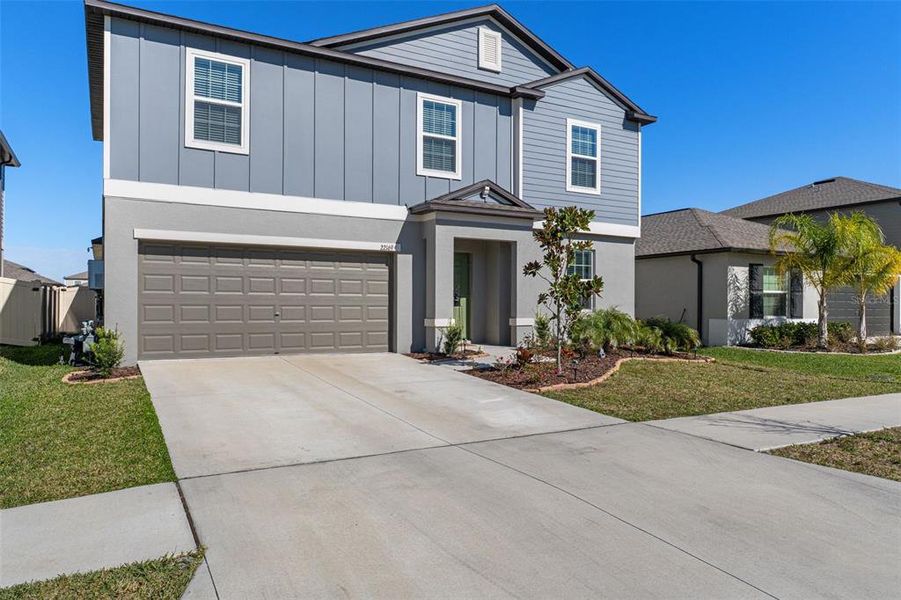 Front exterior of a new home in , Land O' Lakes, FL, highlighting curb appeal (Image 28).