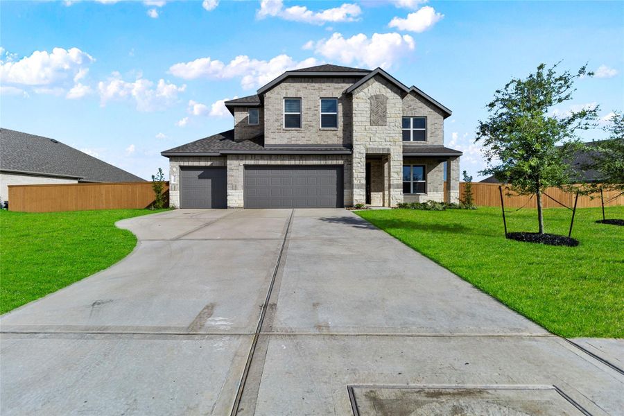 Front exterior of a new home in River Ranch Estates, Dayton, TX, highlighting curb appeal (Image 19). Front exterior of a new home in River Ranch Estates, Dayton, TX, highlighting curb appeal (Image 19).