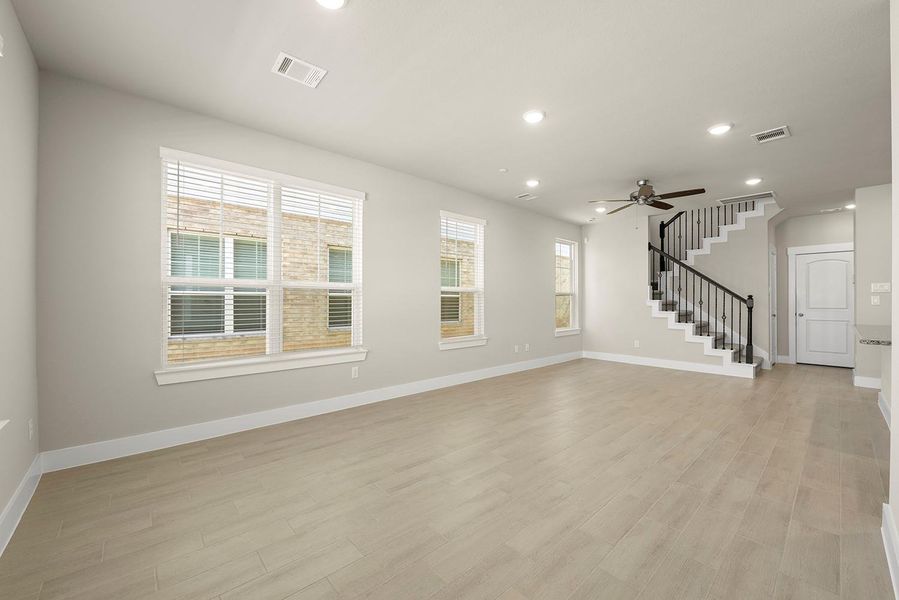 Expansive windows that invite natural light to dance through spacious living areas, creating a welcoming atmosphere perfect for gatherings or quiet moments of reflection. Expansive windows that invite natural light to dance through spacious living areas, creating a welcoming atmosphere perfect for gatherings or quiet moments of reflection.