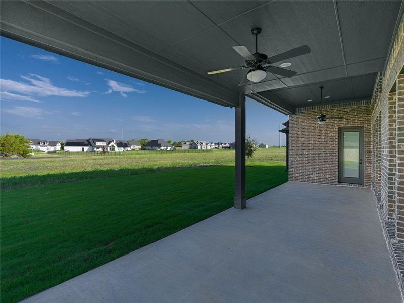 View of patio / terrace with a ceiling fan and a residential view View of patio / terrace with a ceiling fan and a residential view