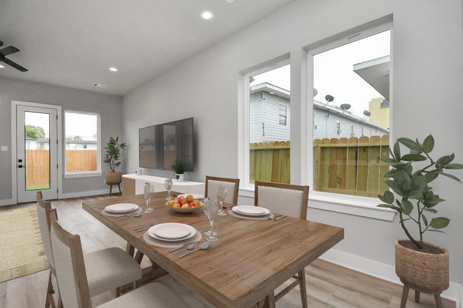 Bright dining area with large windows and modern finishes. Open layout flows seamlessly into the living space, perfect for everyday living and entertaining.