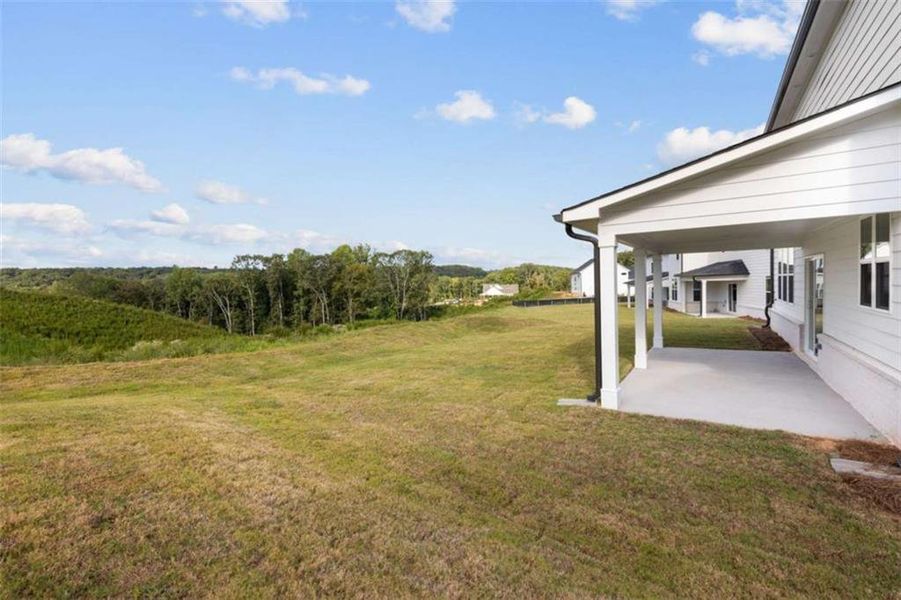 Exterior details and patio area of a home in The Estates at Gainesville Township, Gainesville (Image 8).