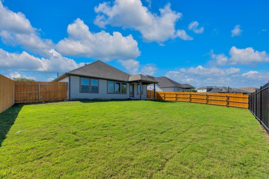 Exterior details and patio area of a home in Prairie Winds, Hutto (Image 24).